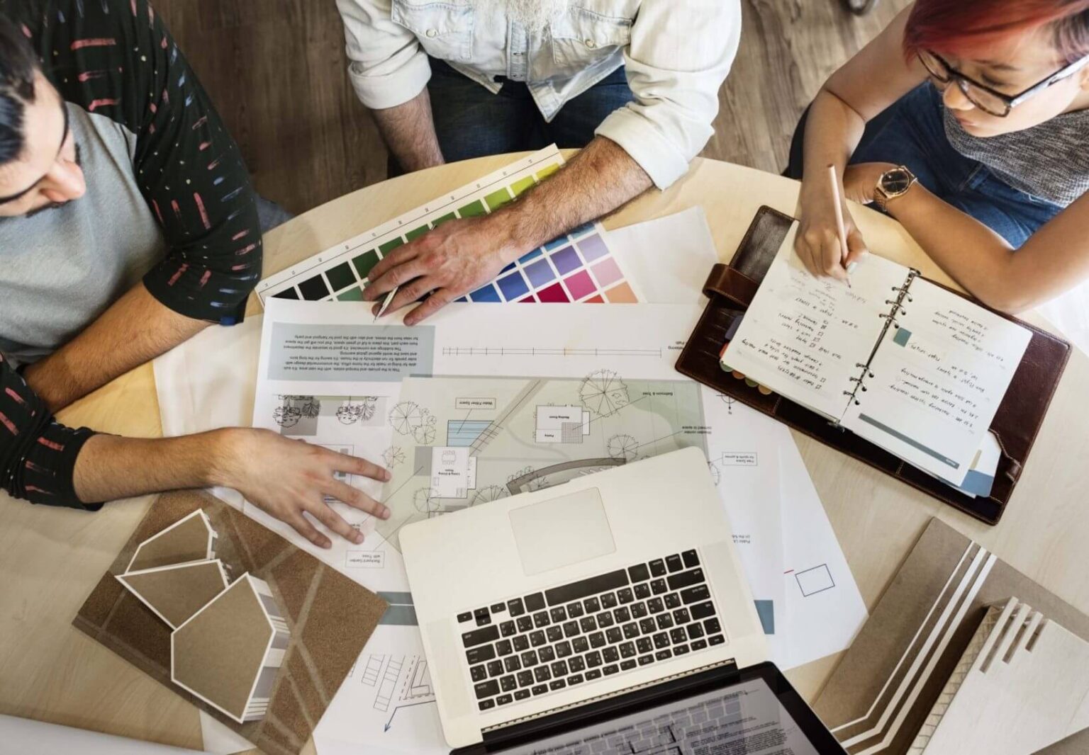 Three people analyzing the project