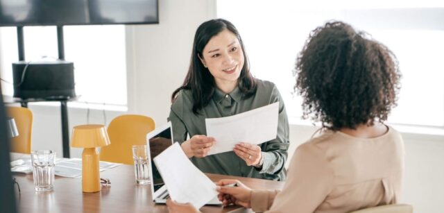 Two women discussing ideas